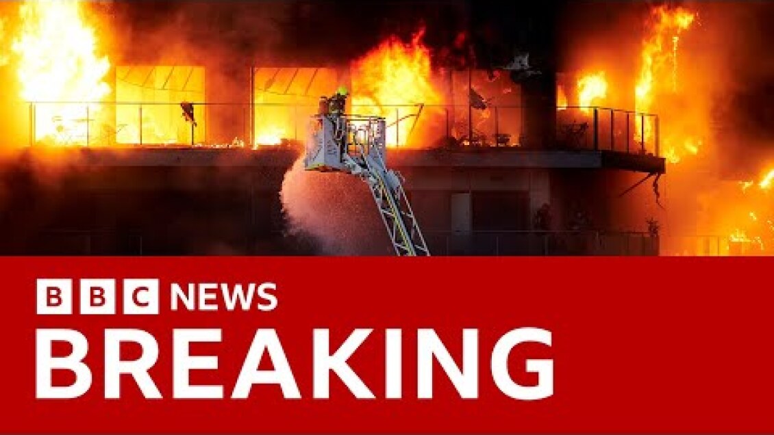 Firefighters battle huge blaze engulfing  apartment block in Spain | BBC News