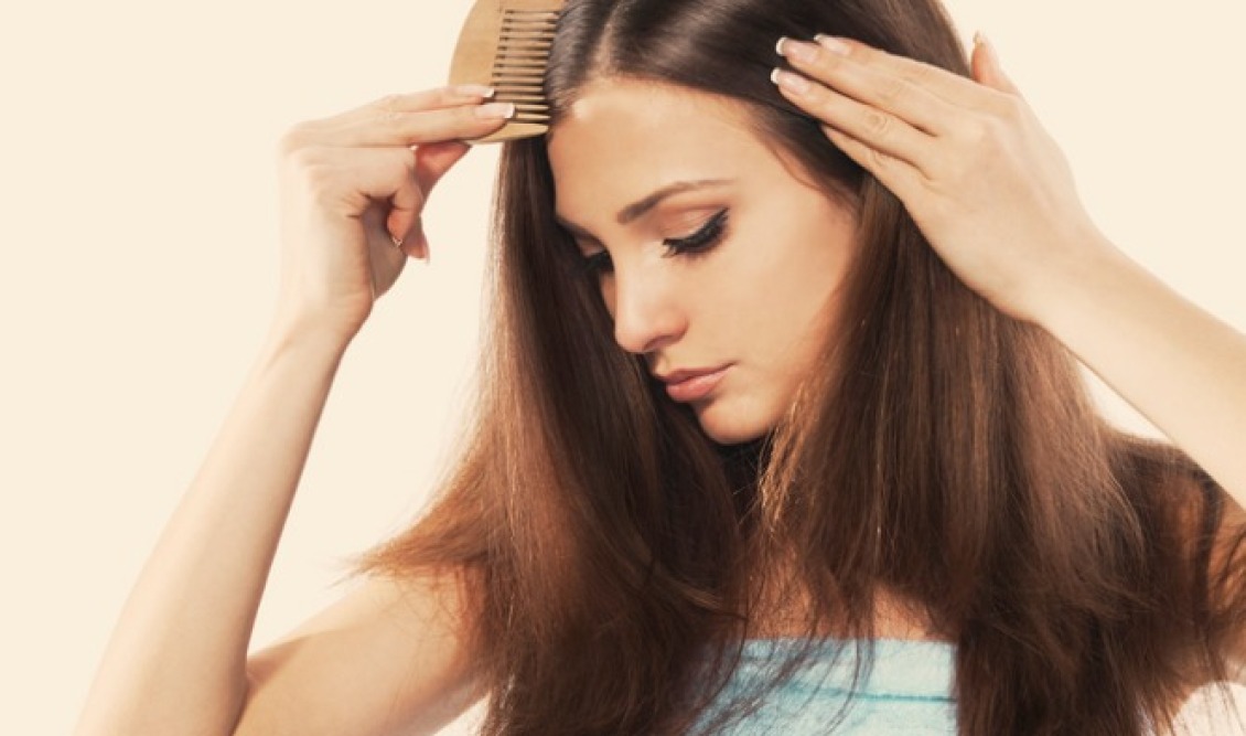 young-woman-with-beautiful-long-hair-combing-her-locks-picture-id164173339